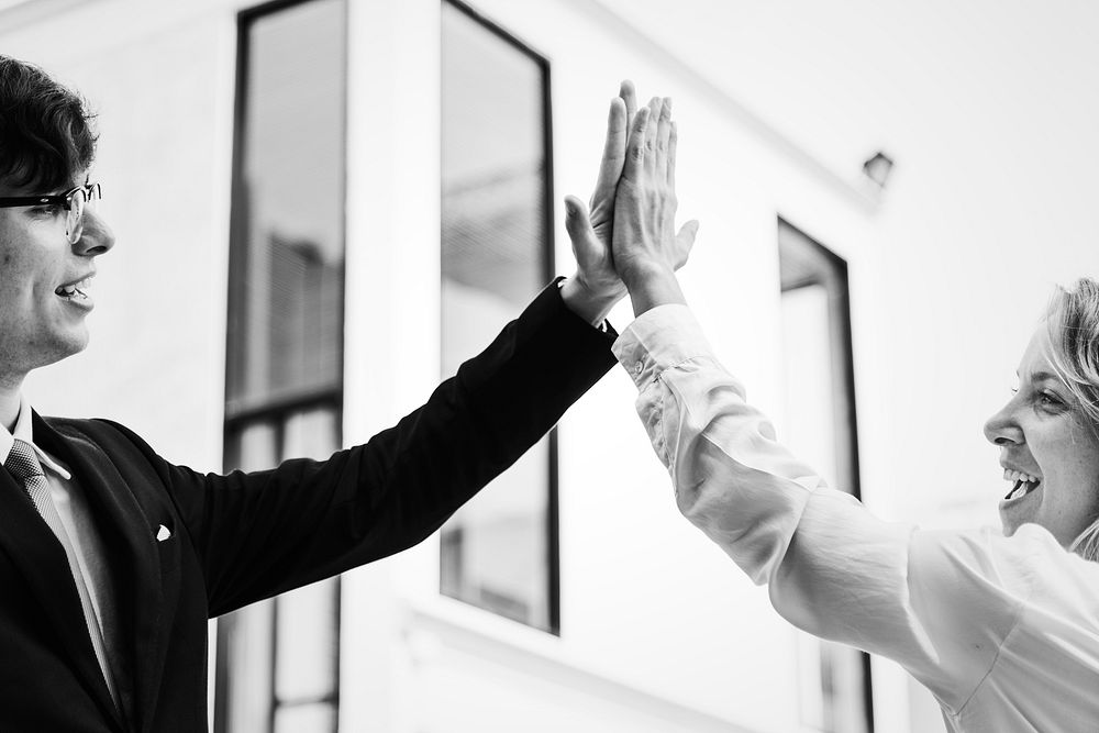 Businesspeople giving a high five