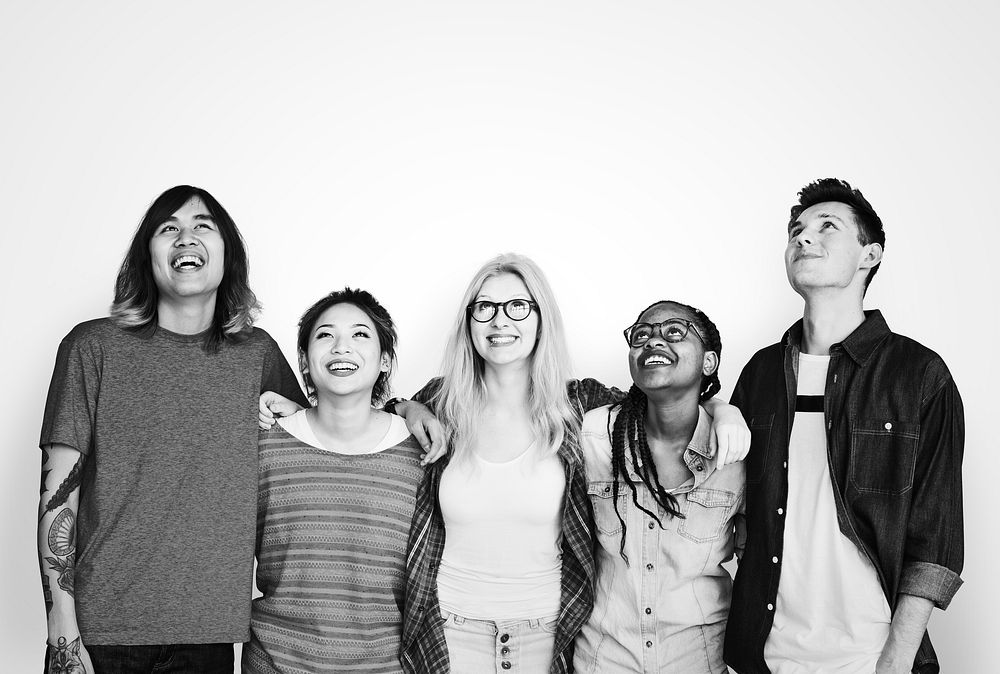 Diverse friends arms around and smiling