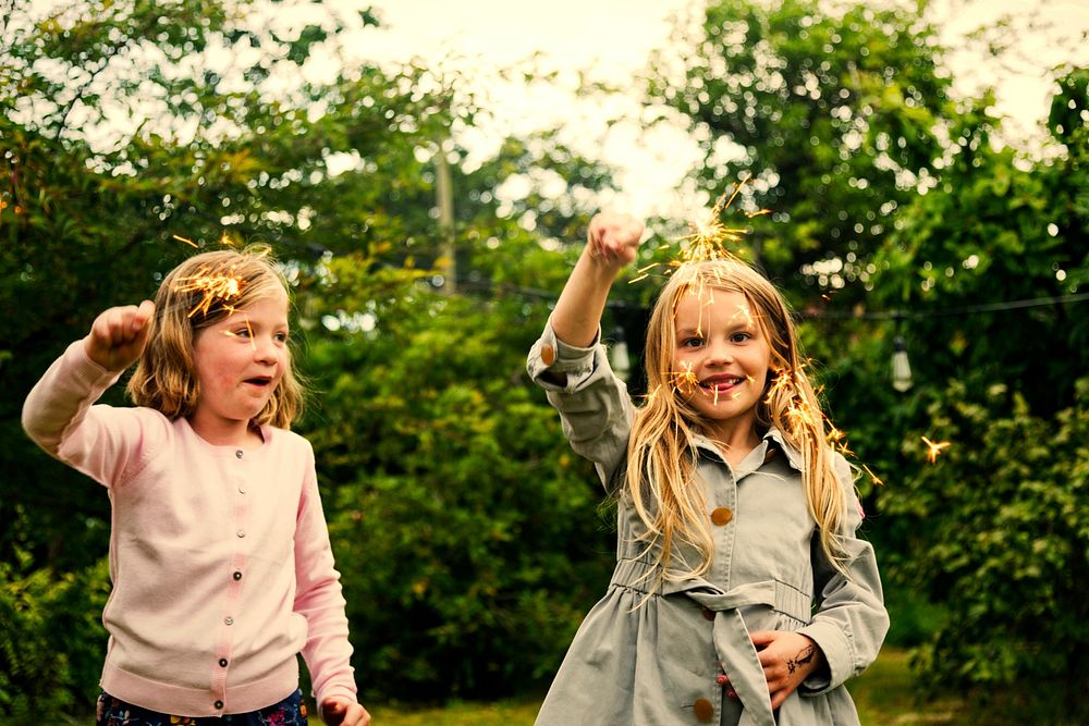 Playful little girls with sparklers