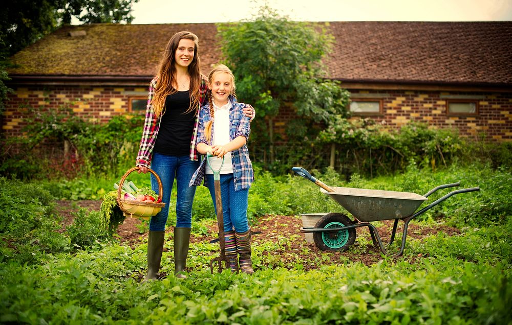 Mother and daughter working on a farm
