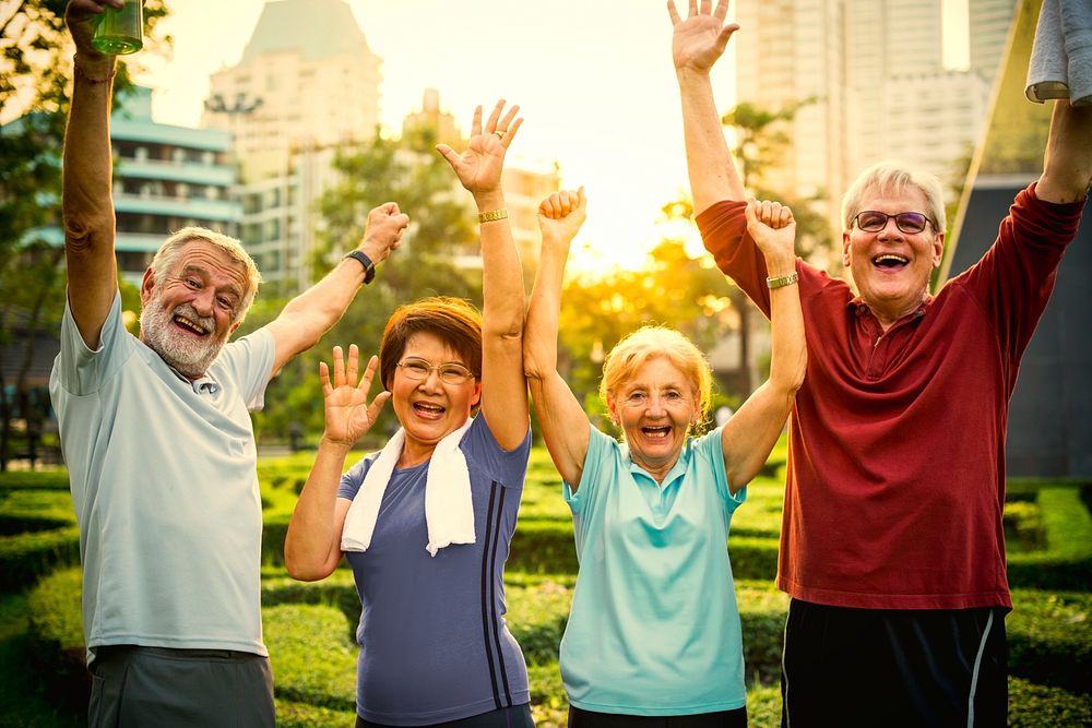 Active seniors working out in the park