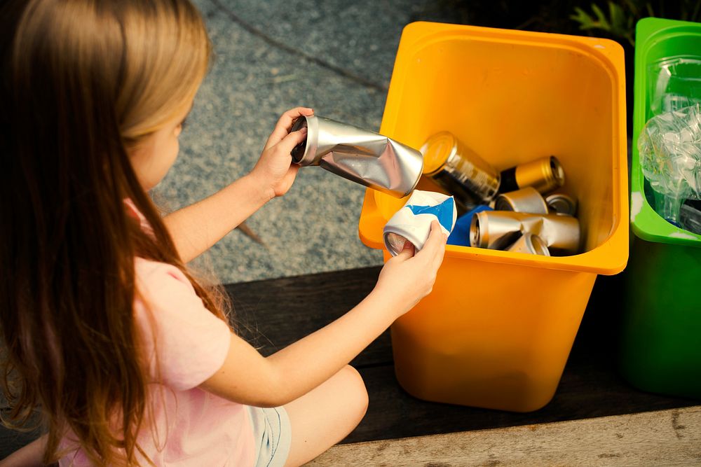 Kids learning how to recycle trash