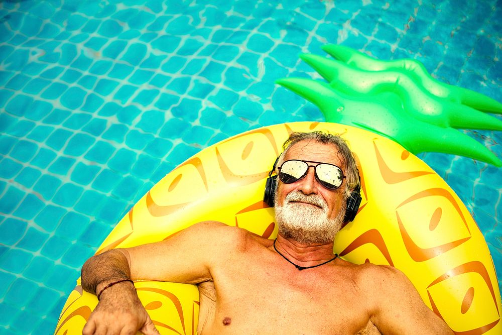Senior man relaxing in a pool