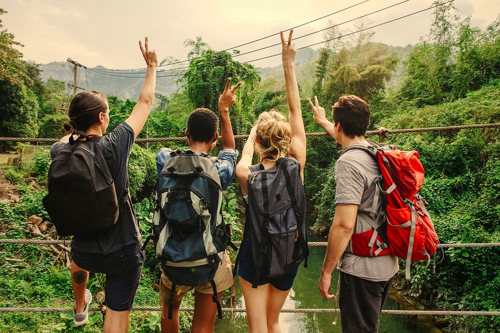 Group of friends hiking through the jungle