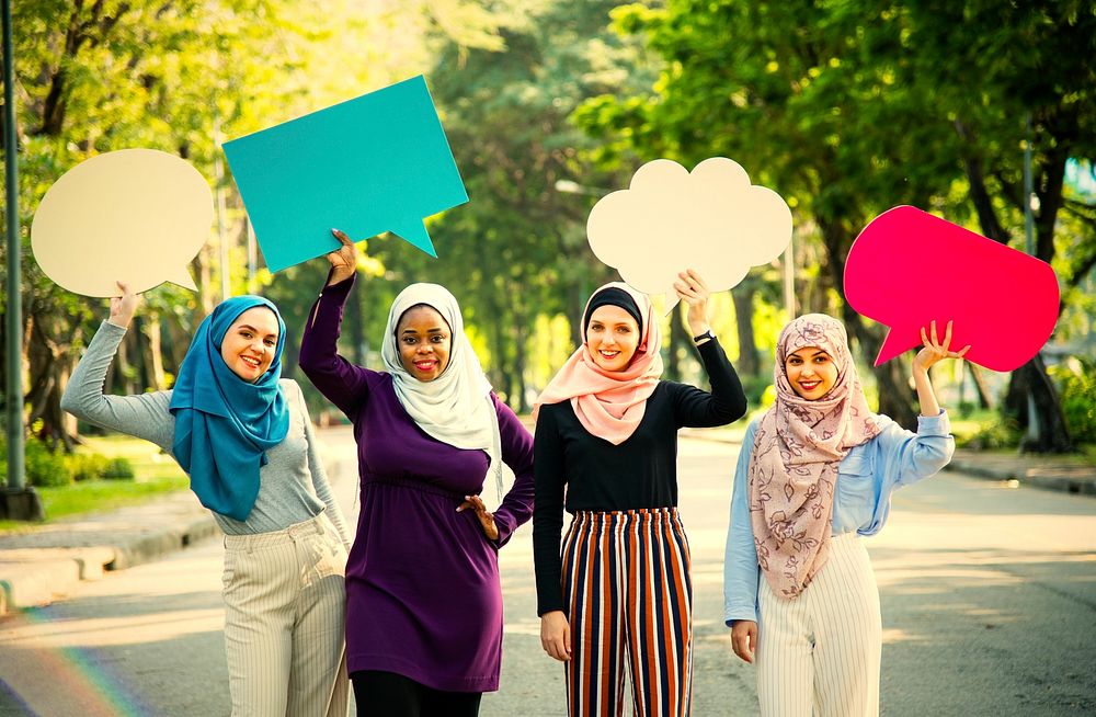 Group of muslim women holding speech bubbles