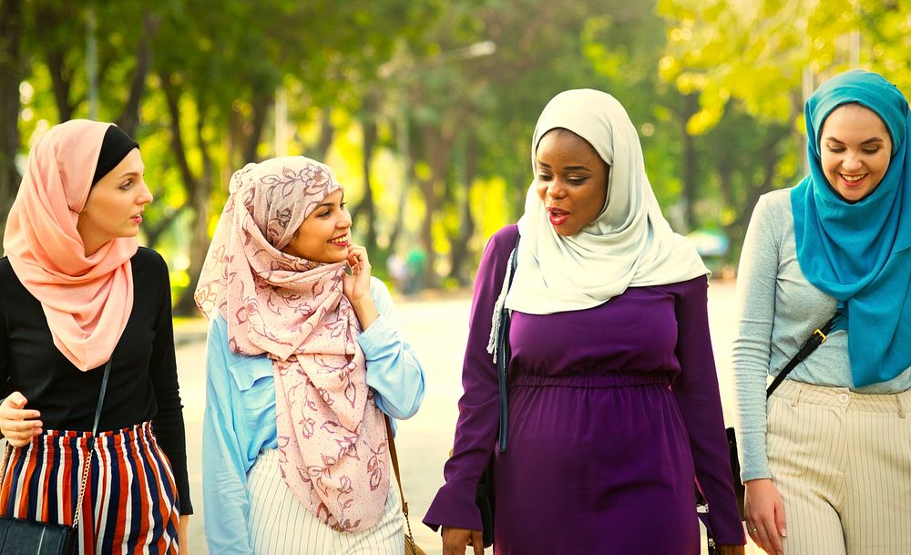 Muslim female friends walking in the park