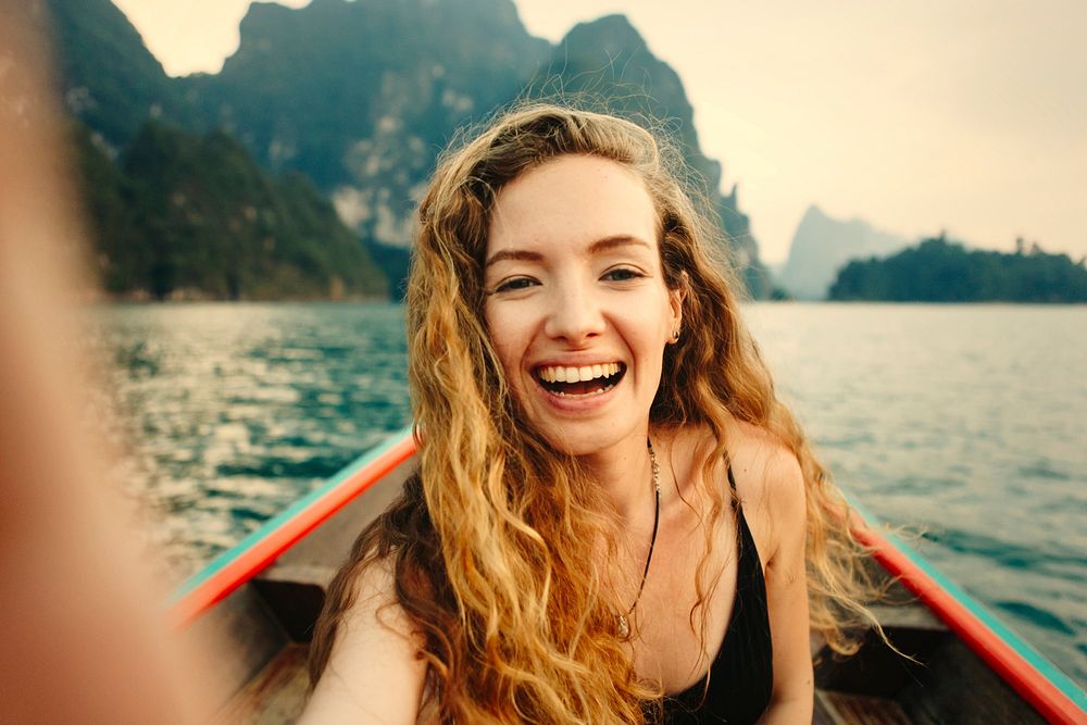 Beautiful woman posing on a boat
