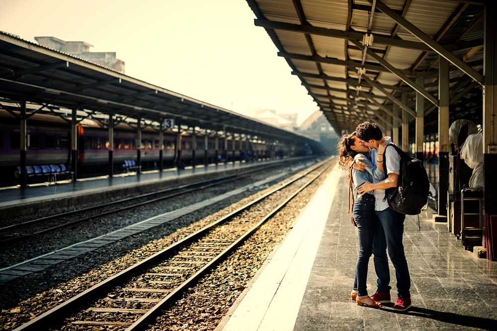 Couple kissing at the train platform
