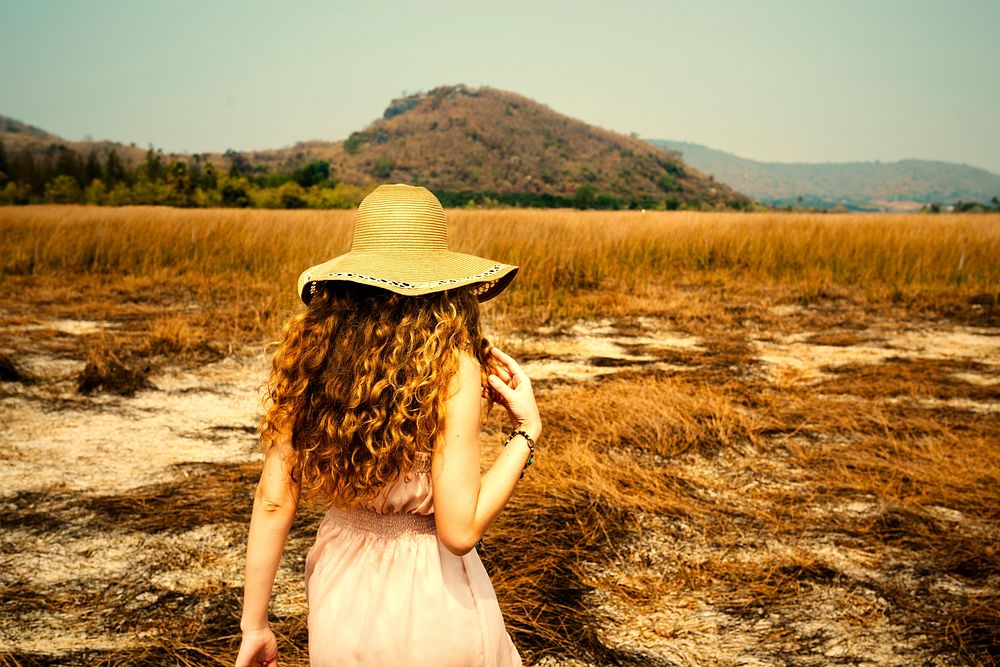 Girl walking into a field