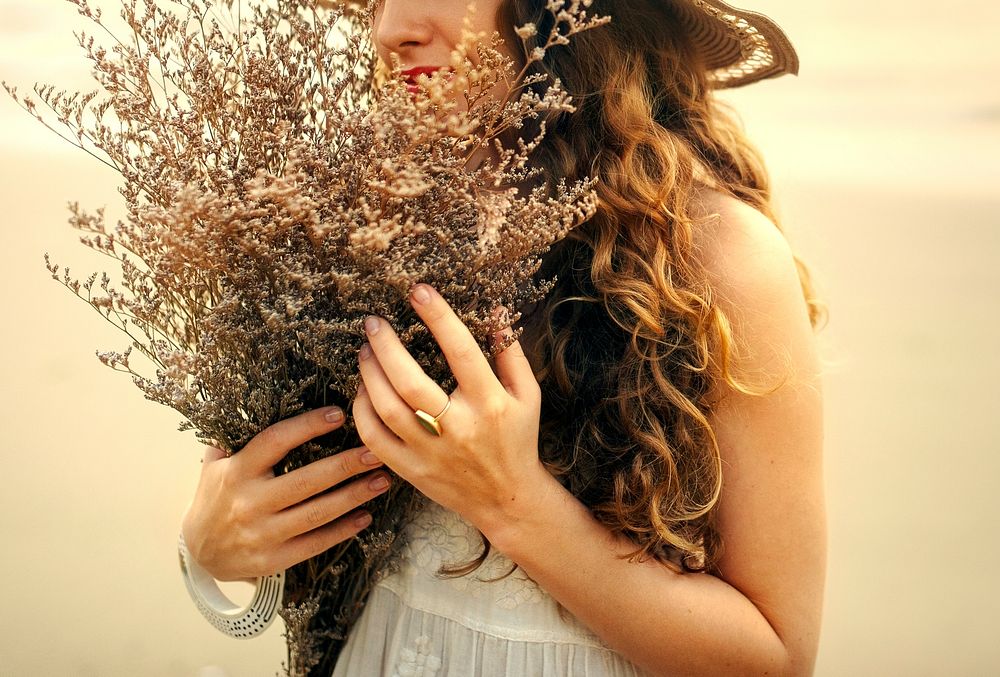 Girl with a bouquet of dried flowers