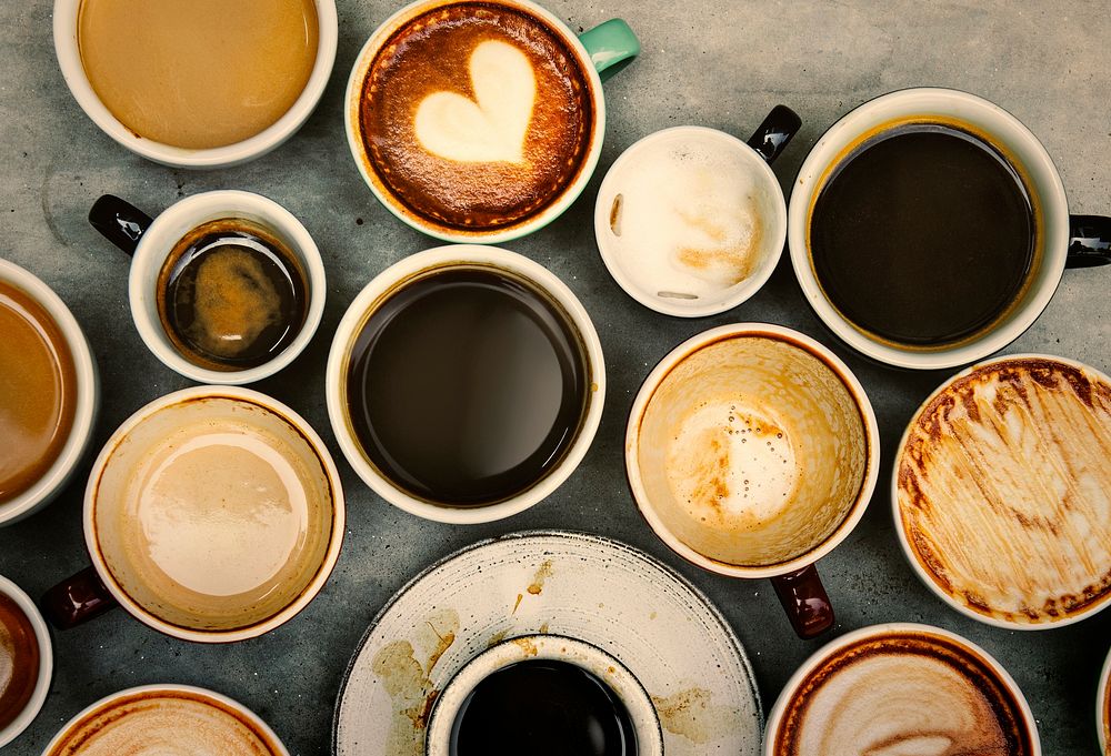 Variety of cups with hot coffee