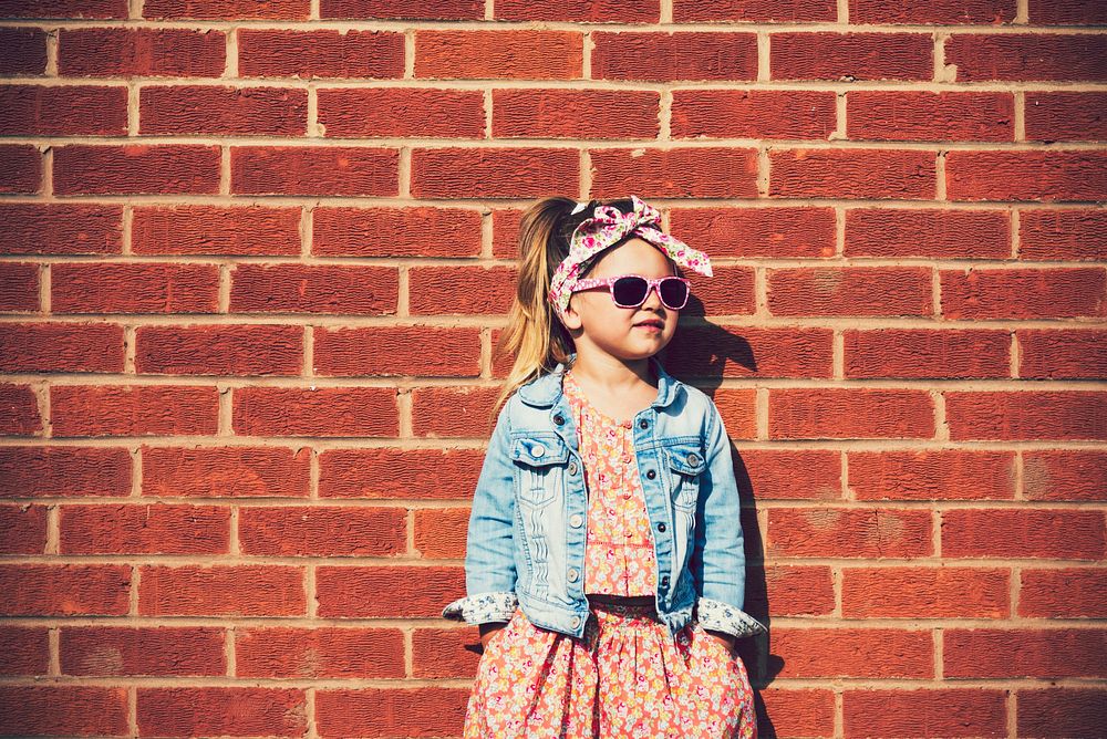 Adorable little fashionista girl posing