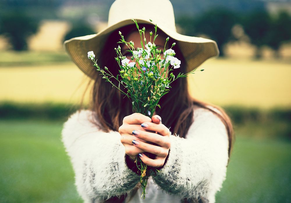 Woman holding a bouquet of wild flowers