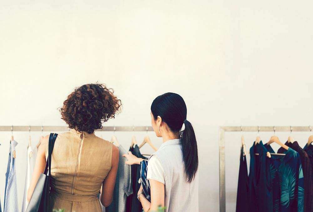 Woman checking out clothes in a shop