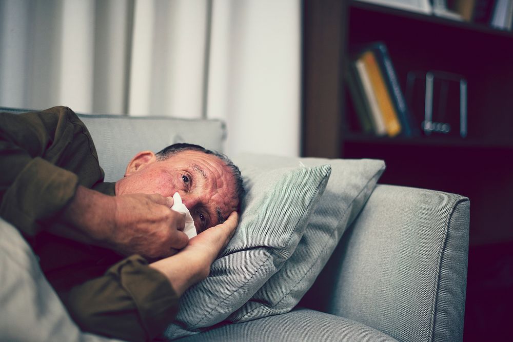 Sick elderly on a sofa
