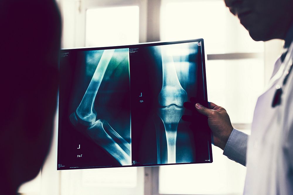 Doctor checking a patient's x-ray film