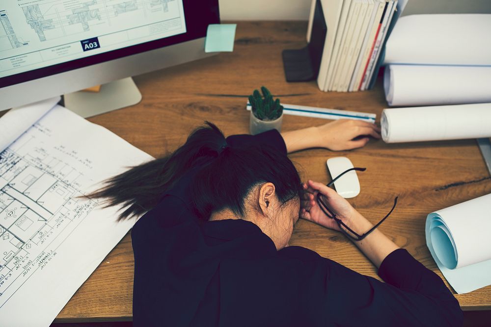Office worker sleeping at desk