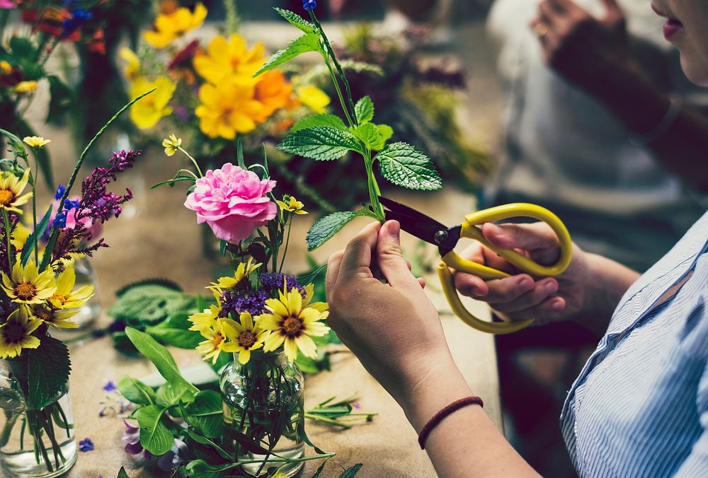 Woman making a flower arrangement
