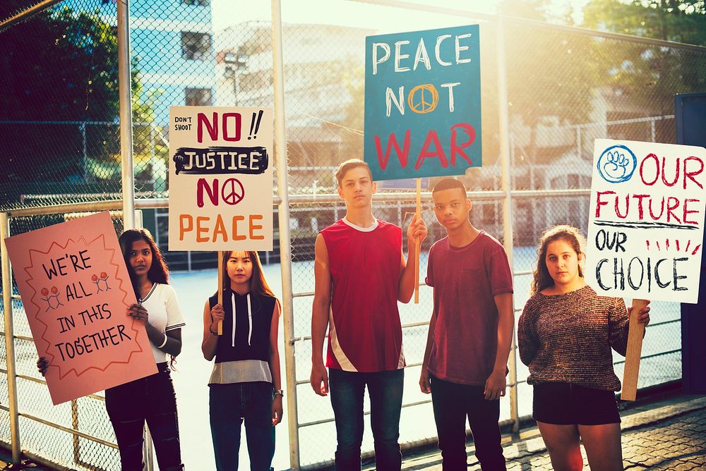 Group of teenagers protesting against war