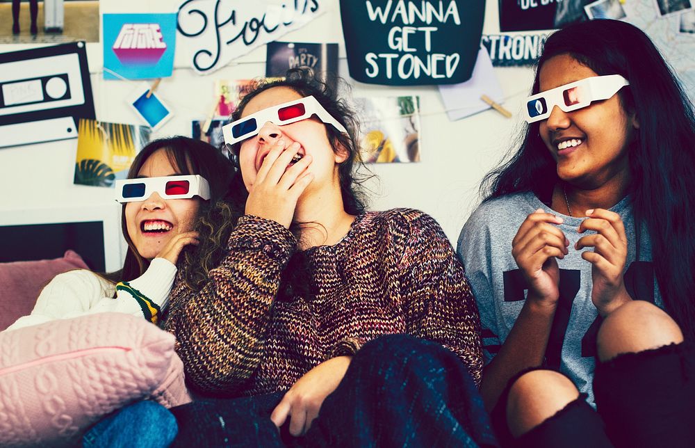 Teenage girls wearing 3d movie glasses