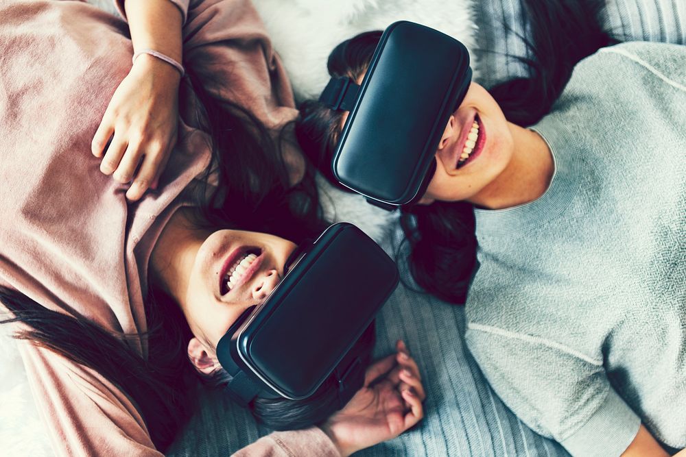 Women experiencing virtual reality with VR headsets