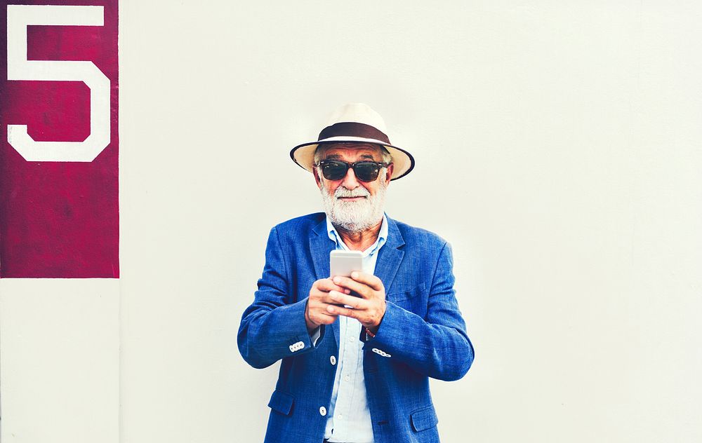 Cool mature man with a phone