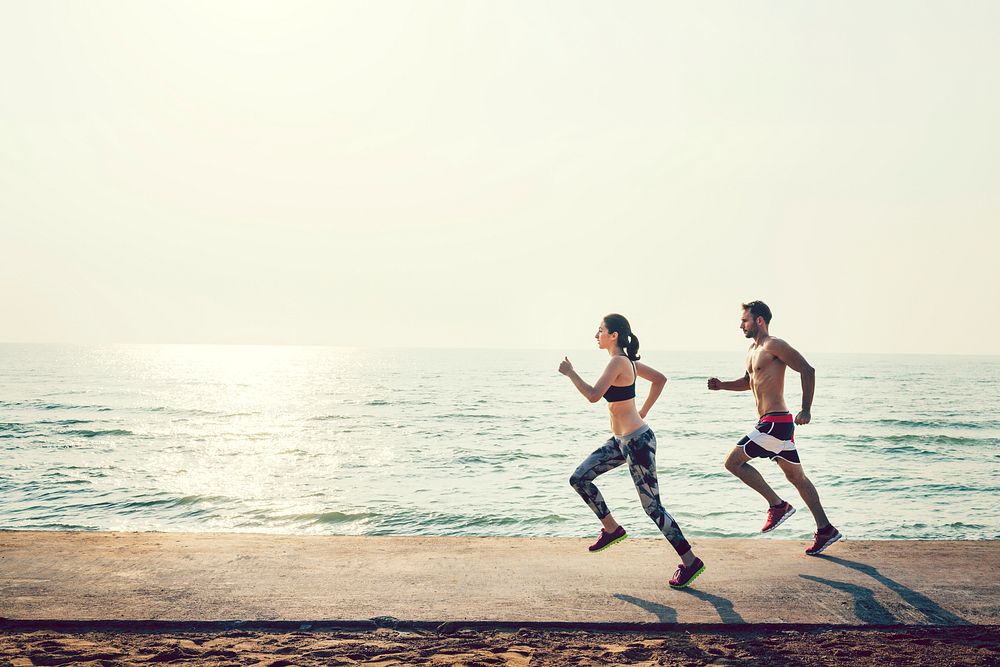 Couple jogging at the beach
