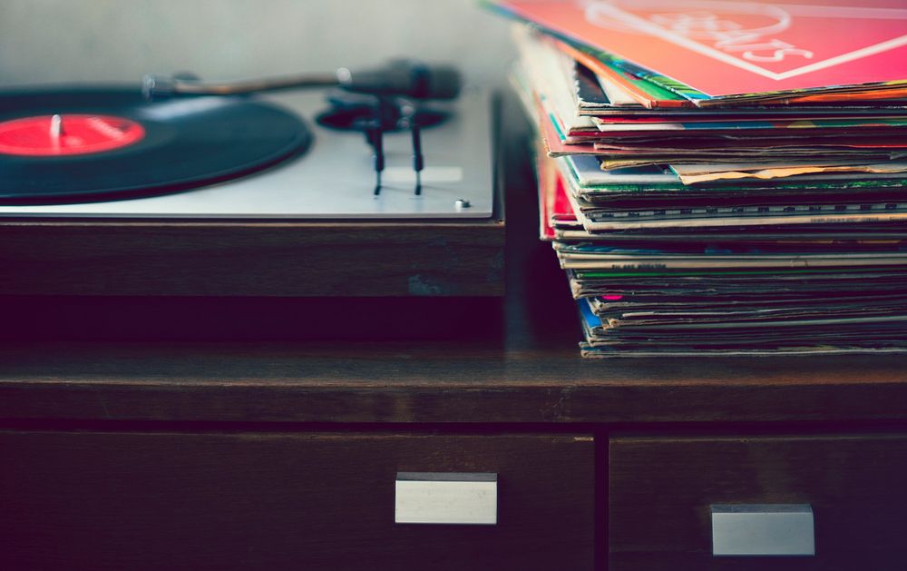 Record player and vintage vinyls on the table