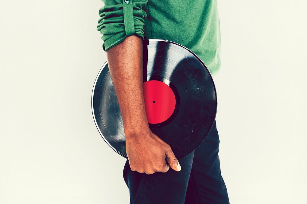 Man holding a vintage vinyl record