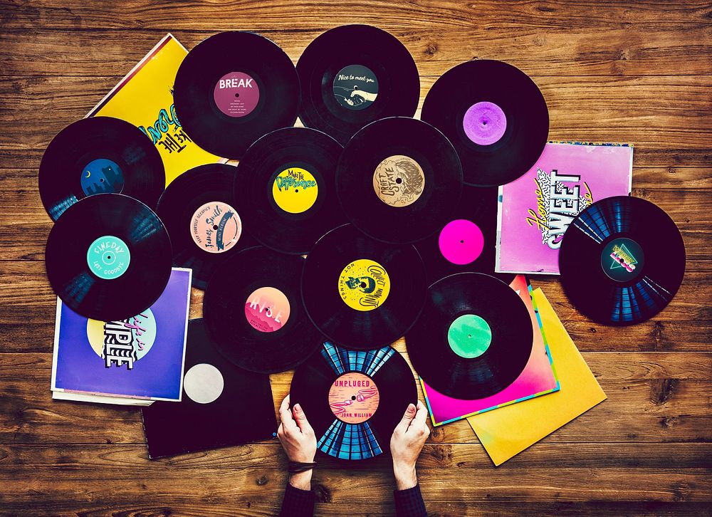Music lovers with vinyl records collection