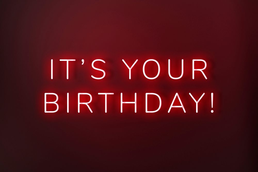 Glowing it's your birthday neon typography on a red background