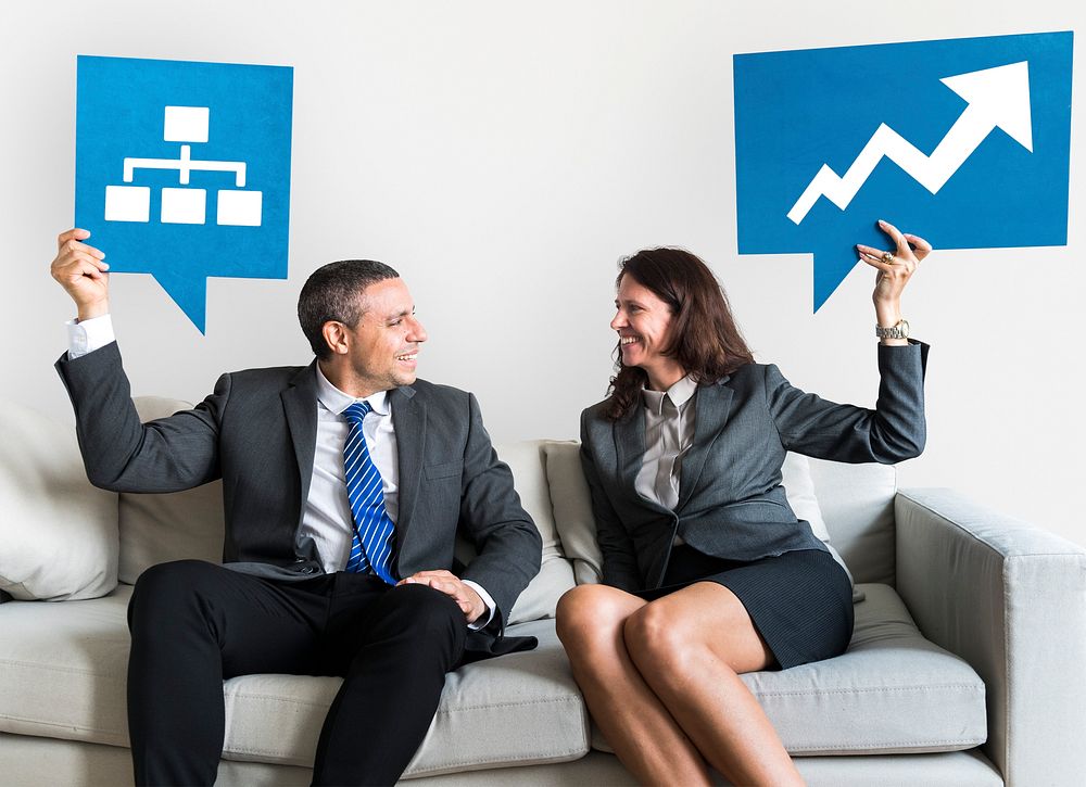 Business people holding speech bubbles with growth icons
