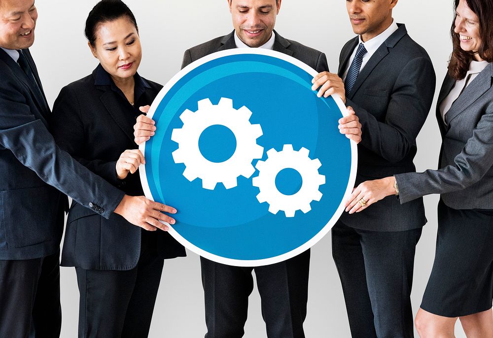 Diverse business people holding a teamwork icon