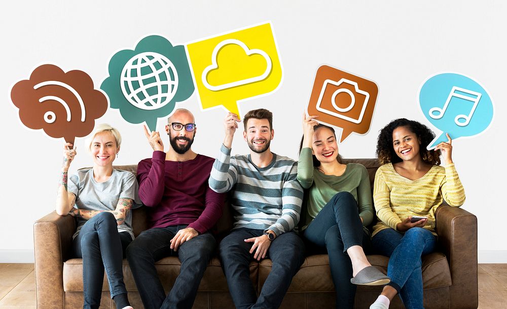 Cheerful people holding social media icons