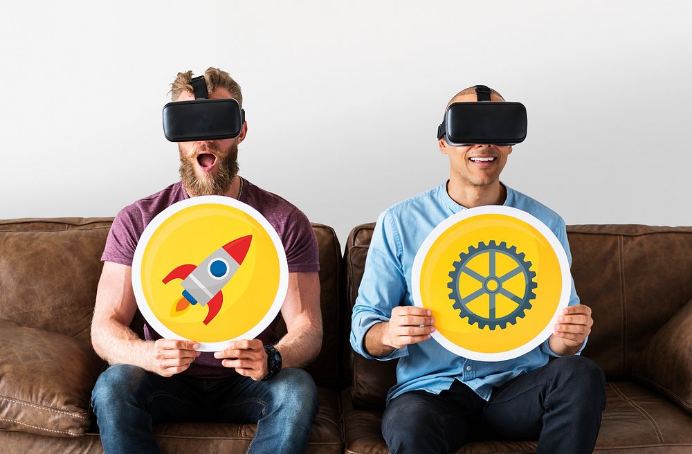 Men with VR goggles holding technology signs