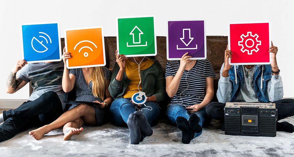 Group of diverse friends holding technology icons