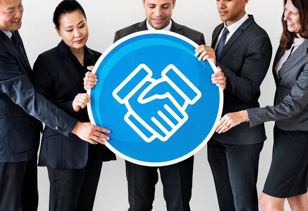 Business people holding a handshake icon