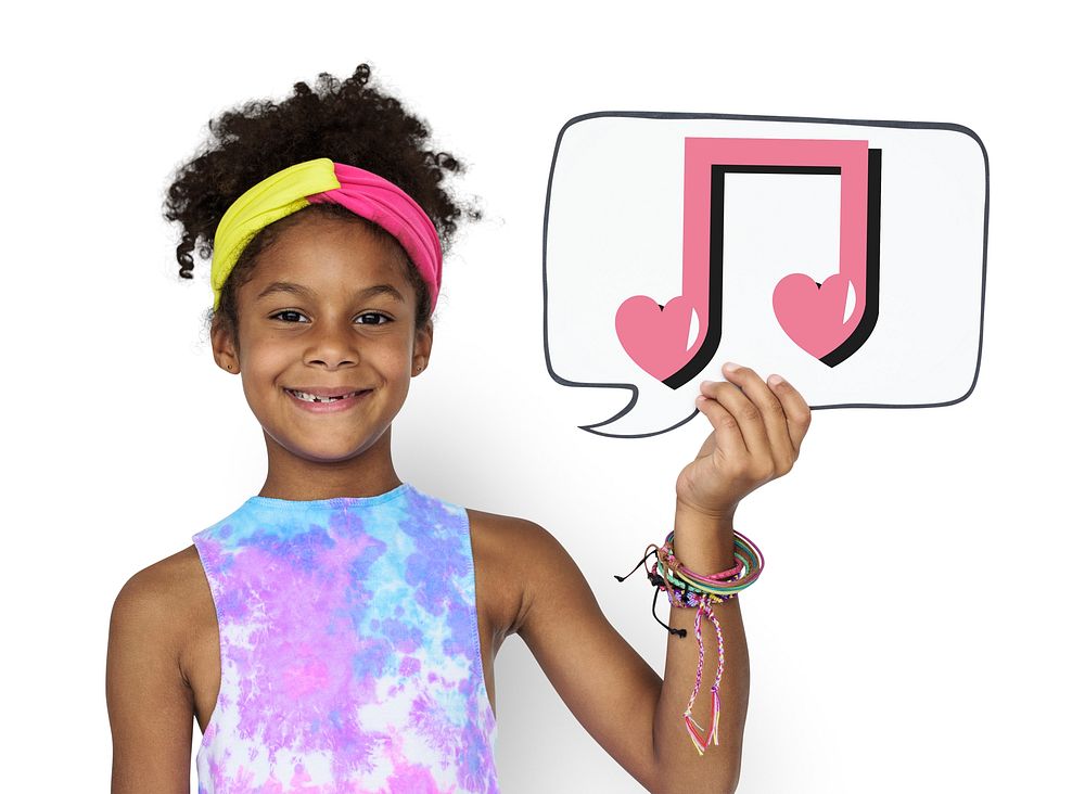 Happy girl holding a speech bubble with music note icon