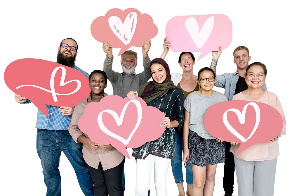 Diverse people holding heart icons