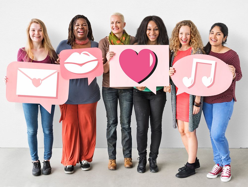 Group of women holding heart icons
