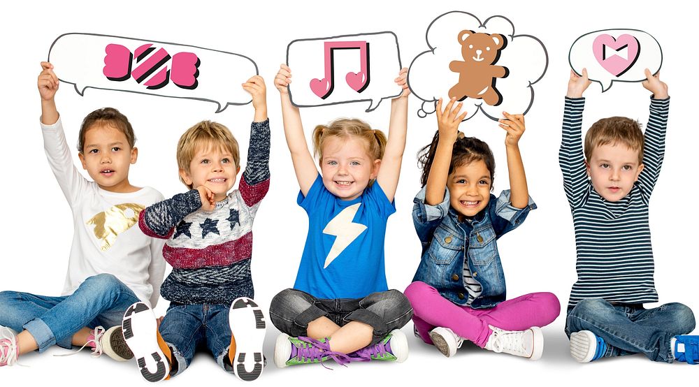 Happy kids holding speech bubbles with cute icons