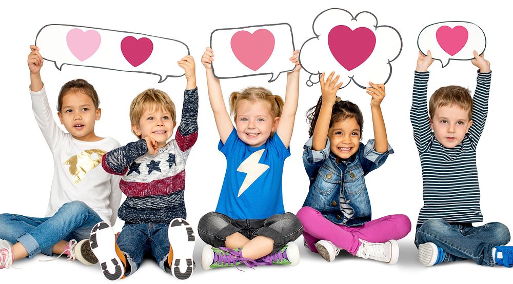 Happy kids holding speech bubbles with heart icons
