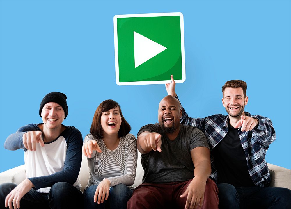 Group of happy friends holding a play button
