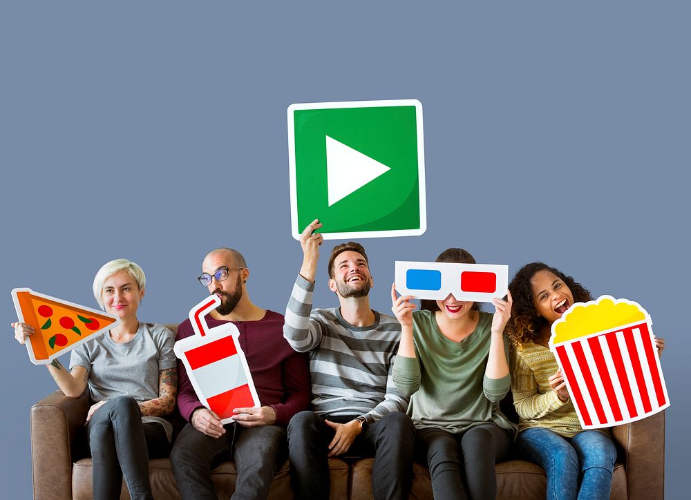 Group of diverse friends holding movie emoticons