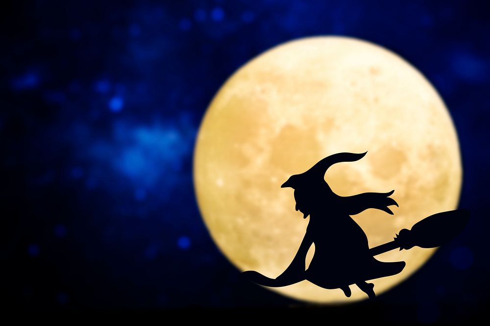 Witch silhouette over a full moon