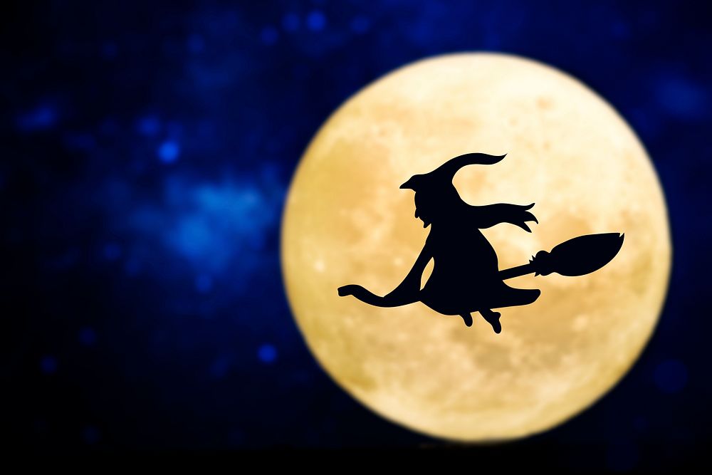 Witch silhouette over a full moon