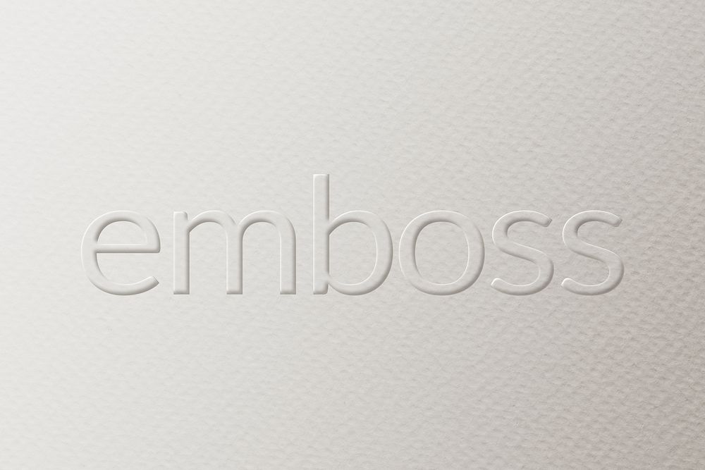 Emboss embossed text on white paper background