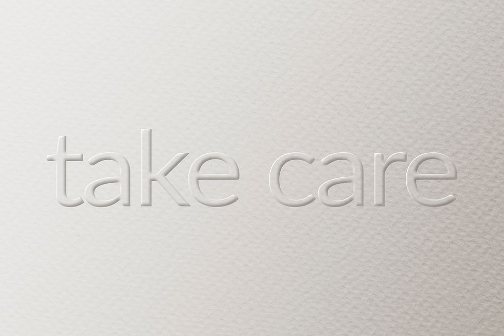 Take care embossed font white paper background