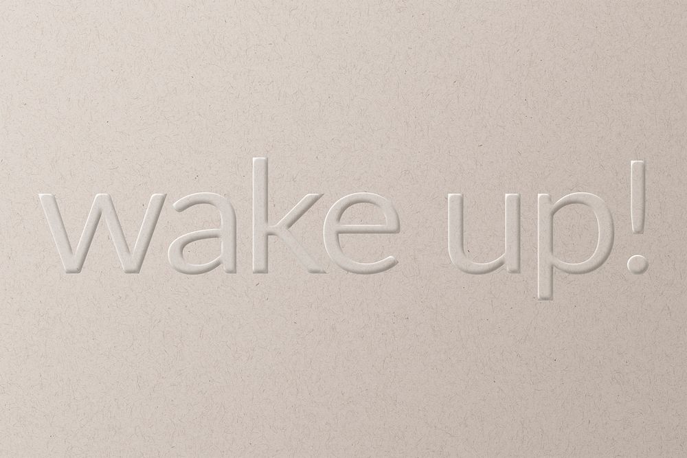 Wake up! embossed font white paper background