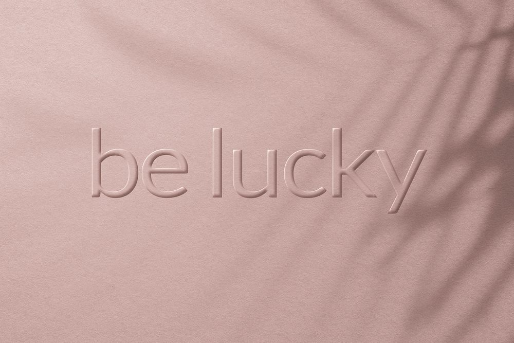 Phrase be lucky embossed typography style